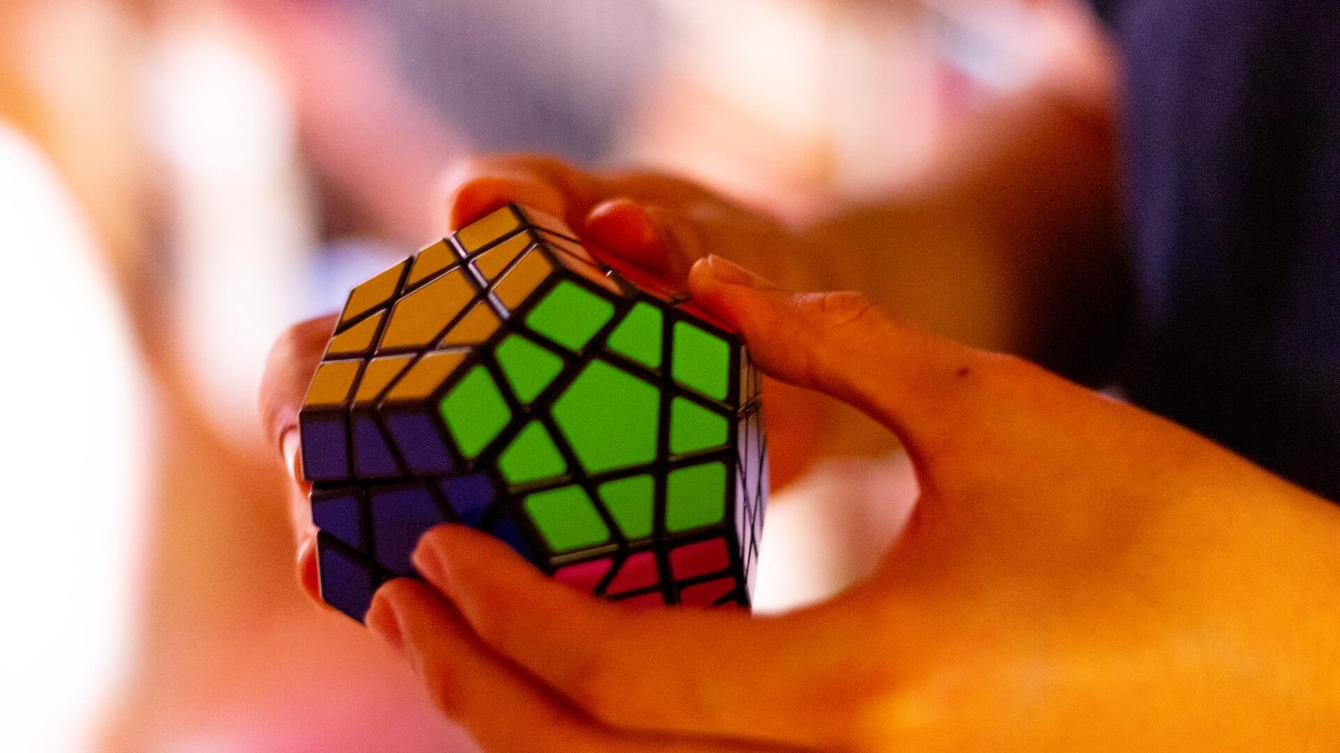 Hands holding a rubix puzzle