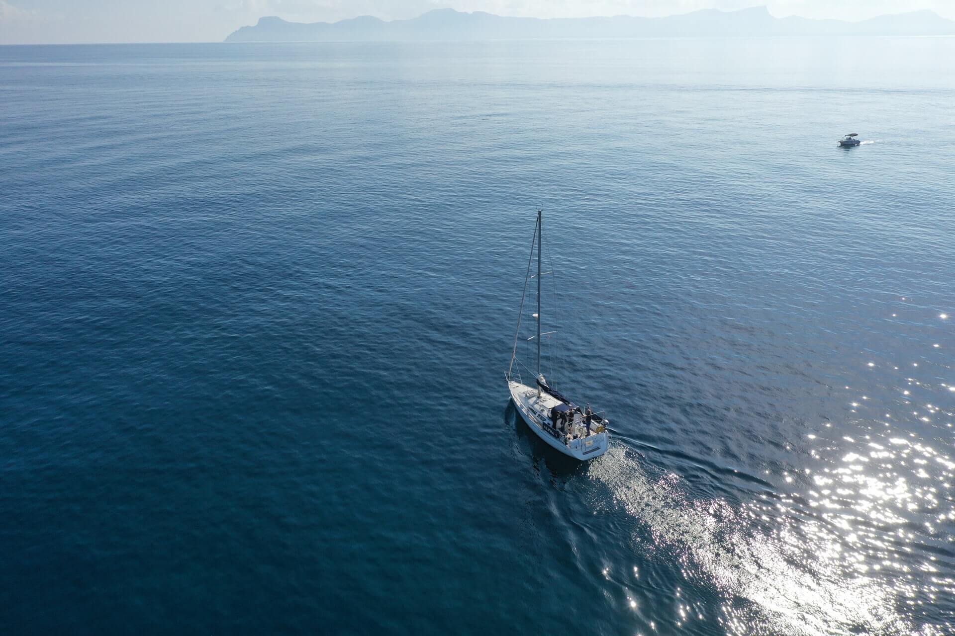 A sailboat crossing an ocean