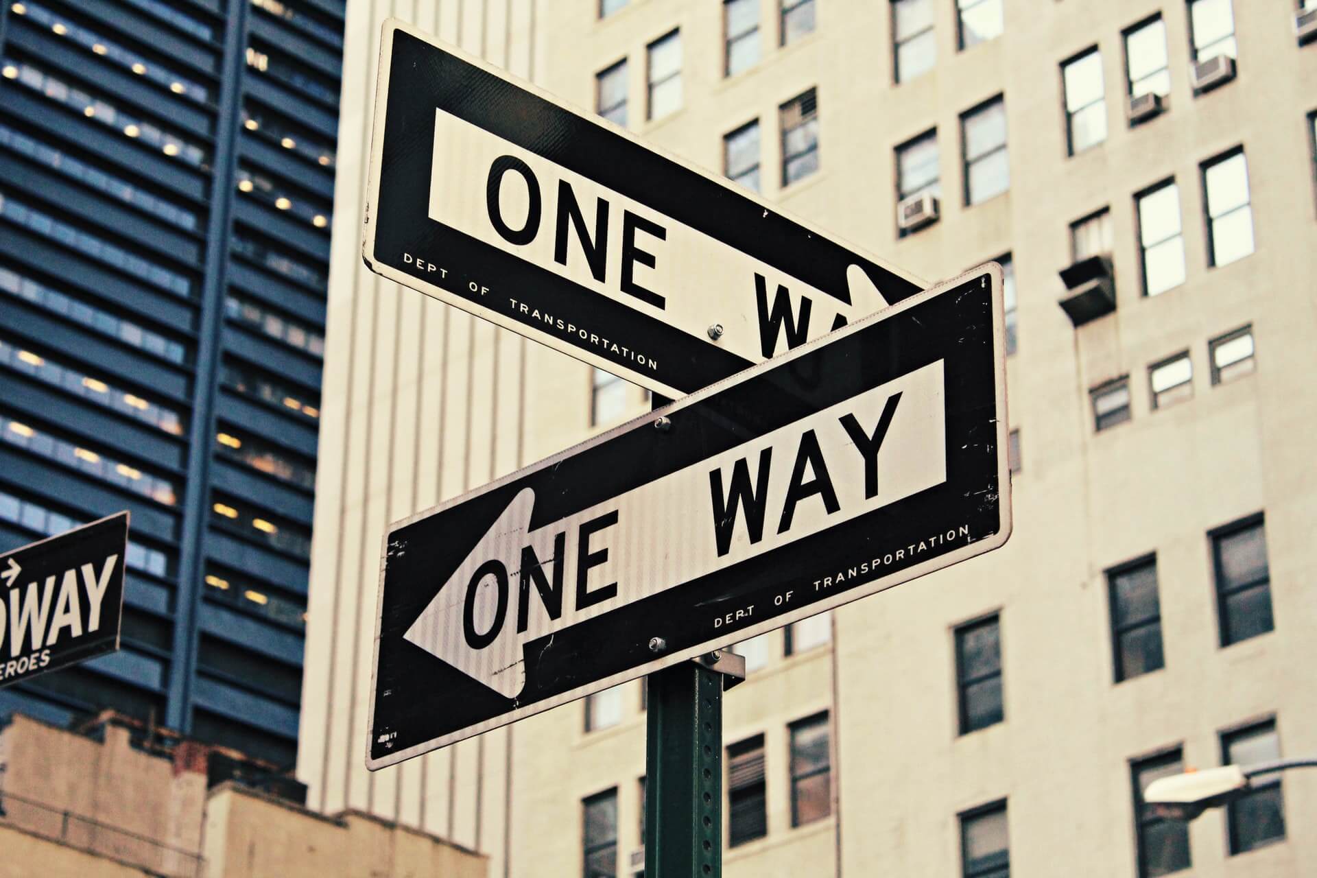 Street signs showing one way