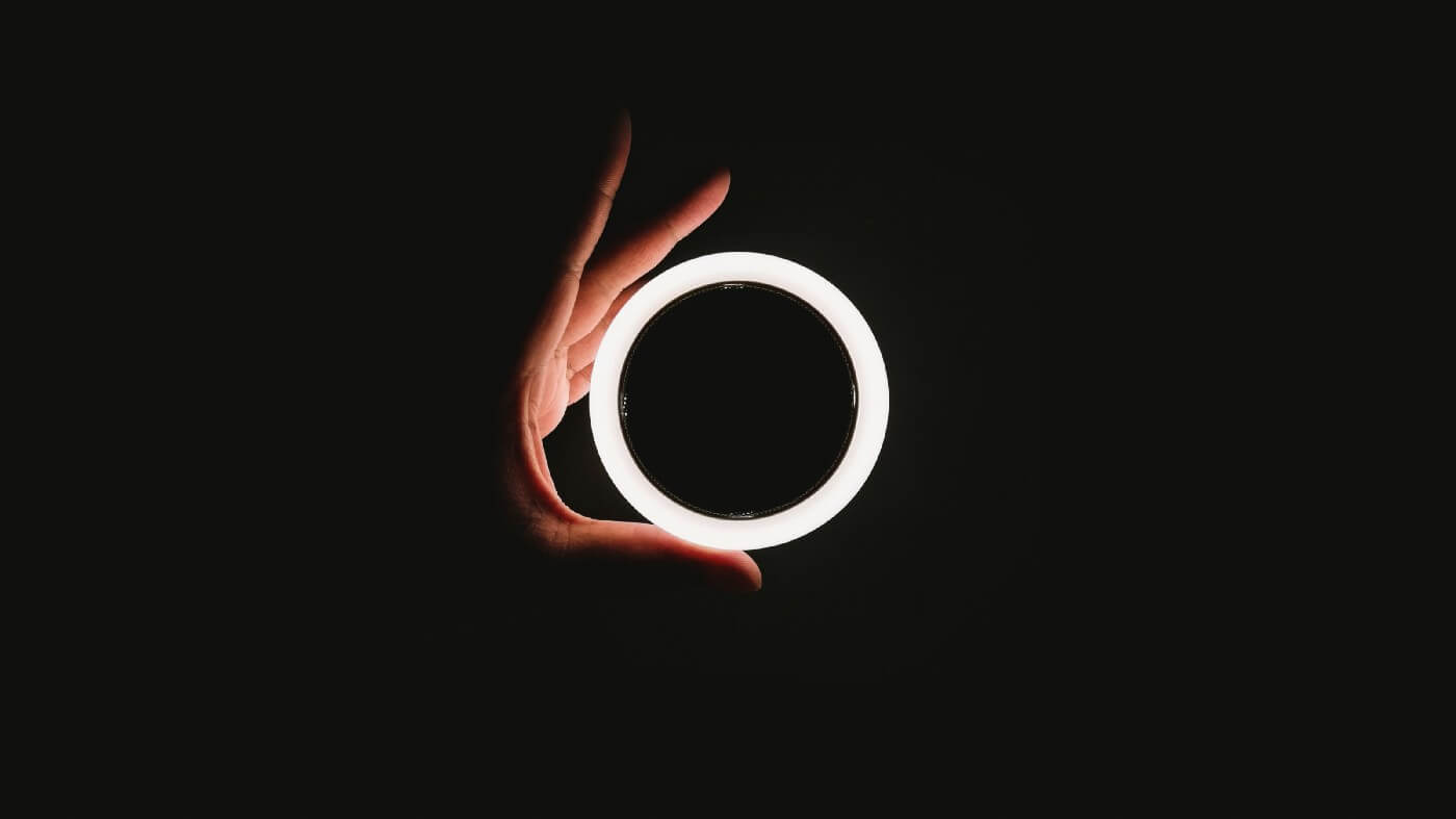 Hand holding a circular light